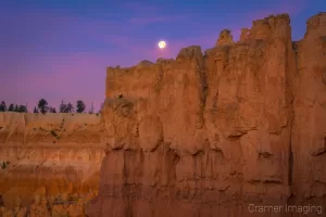 Cramer Imaging's fine art landscape photograph of a Bryce Canyon wall with the moon overhead in Utah