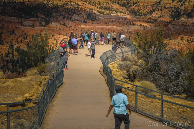 Photograph of a crowd of people gathered at Bryce Point in Bryce Canyon National Park Utah by Audrey Cramer Photography