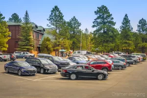 Cramer Imaging's photograph of a busy and crowded parking lot at the Bryce Canyon National Park Visitors' Center in Utah