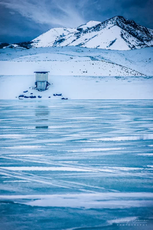 Audrey Cramer Photography's professional quality landscape photograph of scenic Devil's Creek Reservoir or lake frozen with ice and snow