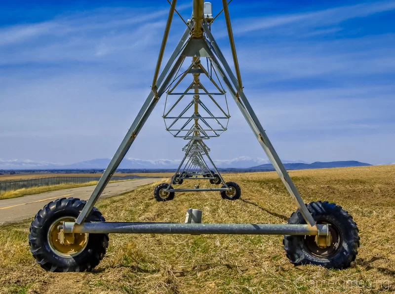 Professional landscape photograph of farm equipment pivot line in Ririe, Idaho by Audrey Cramer Photography