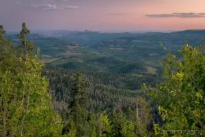 Cramer Imaging's fine art landscape photograph of an evening view down into a forested valley at sunset