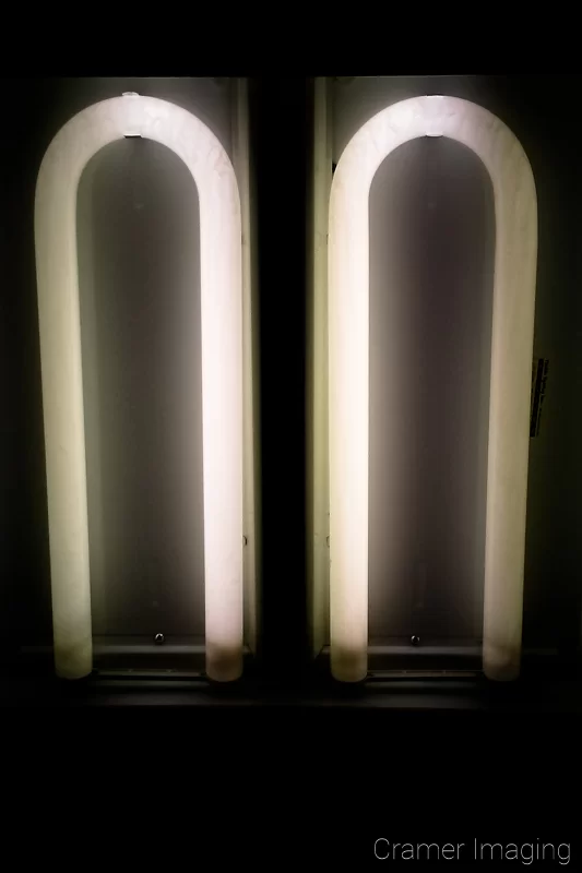 Audrey Cramer Photography's photograph of two fluorescent lights without covers on the ceiling