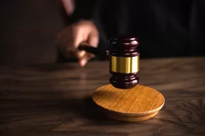 Photograph of a hand holding a gavel