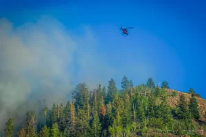 Cramer Imaging's landscape photograph of a helicopter fighting a wildfire near Panguitch Lake Utah