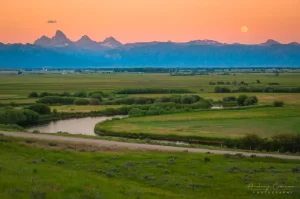 Cramer Imaging's professional quality landscape photograph of the Teton mountains and river at moon rising in Tetonia, Teton, Idaho