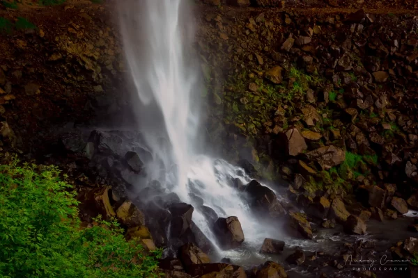 Cramer Imaging's fine art landscape photograph of a waterfall cascading down onto rocks with moss and plants in Twin Falls Idaho