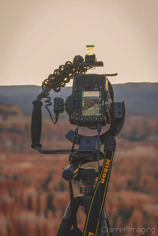 Audrey Cramer Photography's photograph of a camera on a tripod taking a picture at Bryce Canyon National Park Utah at sunrise