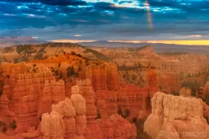 Cramer Imaging's professional quality landscape photograph of a rainbow over Fairyland Point at Bryce Canyon National Park, Utah