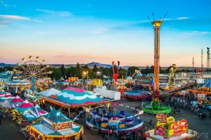 Audrey Cramer Photography's professional quality fine art photograph of aerial view of Eastern Idaho State Fair carnival in Blackfoot, Bingham, Idaho at sunset