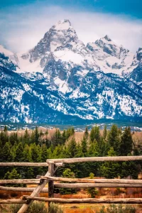 Fine art landscape photograph of a rustic wooden fence against the Grand Teton of Grand Teton National Park Wyoming by Cramer Imaging