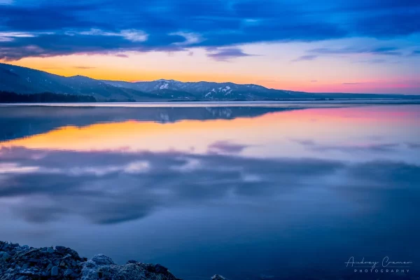 Audrey Cramer Photography's professional quality landscape photograph of Henry's Lake at sunrise or dawn with a water reflection