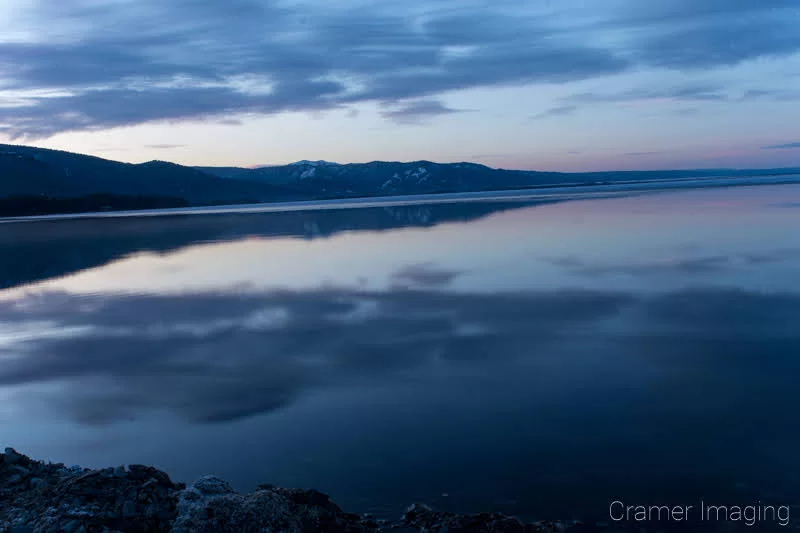 Audrey Cramer Photography's professional quality landscape photograph of Henry's Lake at sunrise or dawn with a water reflection