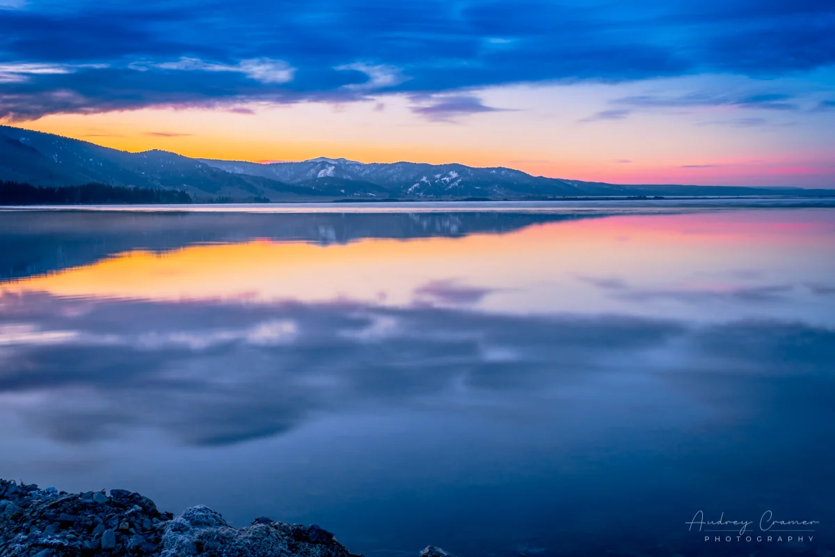 Cramer Imaging's professional quality landscape photograph of Henry's Lake at sunrise or dawn with a water reflection