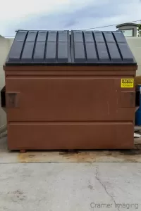 Cramer Imaging's photograph of a brown trash or garbage dumpster for a business complex