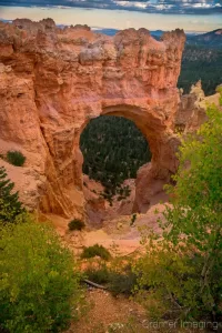 Photograph of the Natural Arch in Bryce Canyon National Park Utah with trash in front of the view