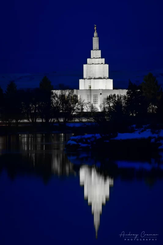 Audrey Cramer Photography's fine art photograph of the Idaho Falls LDS Temple at twilight in winter with Snake River reflection