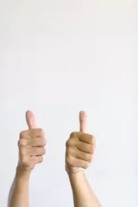 Picture of two thumbs up on a white background