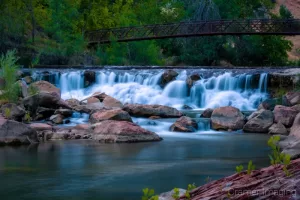 Audrey Cramer Photography's fine art landscape photograph of a waterfall and bridge on the Virgin River in Zion National Park Utah