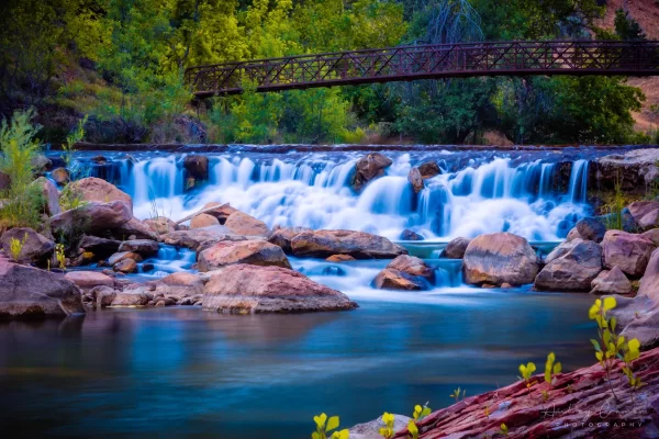 Audrey Cramer Photography's fine art landscape photograph of a waterfall and bridge on the Virgin River in Zion National Park Utah