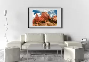 Photograph of Cramer Imaging fine art photograph 'Ancient Red Skyscrapers' on the wall of a living room setting