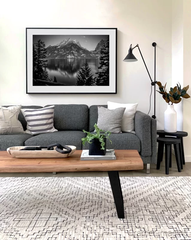 Photograph of Audrey Cramer Photography's fine art photograph "Contemplation" on the wall of a living room a couch and table