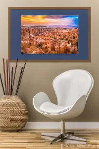 Cramer Imaging's photograph of a framed "Sunset at Bryce" with a chair and plant