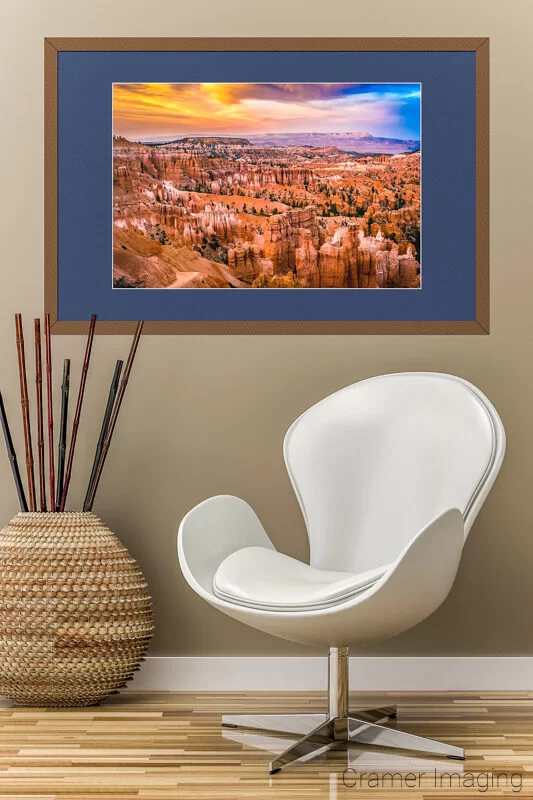 Audrey Cramer Photography's photograph of a framed "Sunset at Bryce" with a chair and plant