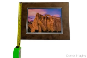 Photograph of a matted Cramer Imaging print of "Grosvenor Sunset" measured with a tape measure