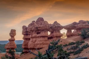 Cramer Imaging's fine art landscape photograph of arches and hoodoos at sunset in Red Canyon, Utah