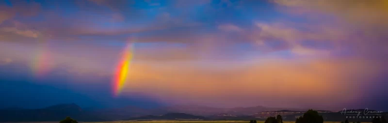 Cramer Imaging's fine art landscape photograph of a double rainbow arc against a dramatic sunset sky in Panguitch, Utah