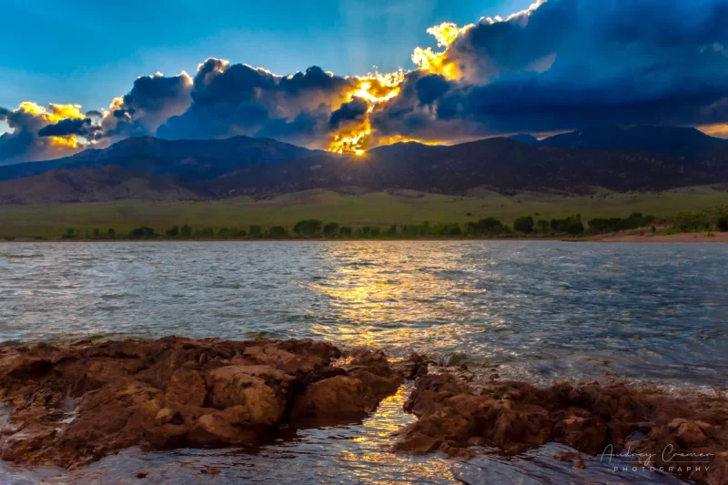 Audrey Cramer Photography's fine art landscape photograph of the sun setting behind clouds at Piute State Park Utah