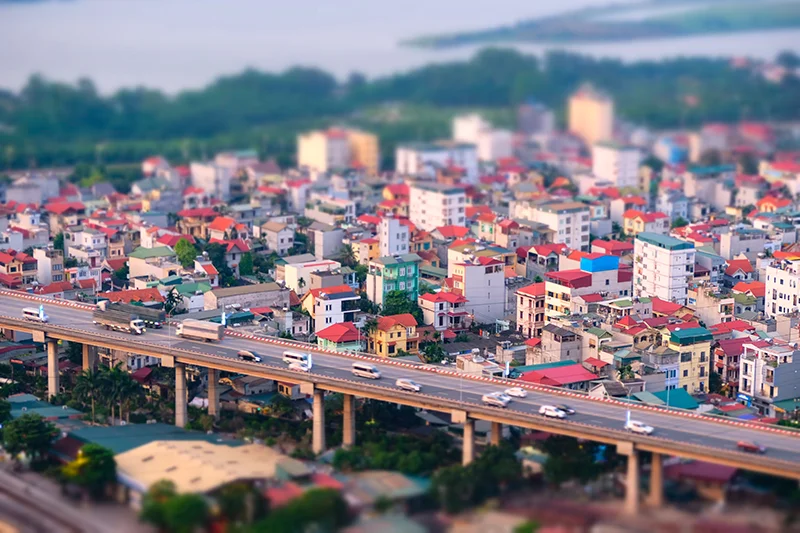 Photograph of an example of tilt-shift photography making a city and highway appear miniature