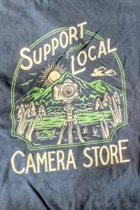 Audrey Cramer Photography's photograph of camera related merch or merchandise, specifically t-shirt with camera-themed graphics