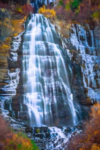 Audrey Cramer Photography's fine art landscape photograph of Bridal Veil Falls Utah surrounded by ice and fall or autumn colors