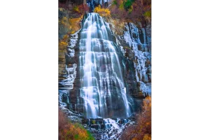 Cramer Imaging's fine art landscape photograph of Bridal Veil Falls Utah surrounded by ice and fall or autumn colors