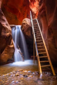 Cramer Imaging's fine art landscape photograph of Kanarra Falls near Kanarraville Utah with silky water and the ladder