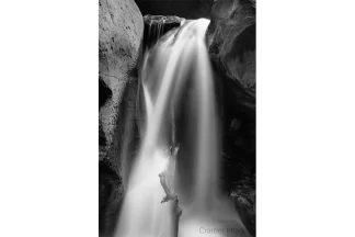 Cramer Imaging's fine art landscape close-up monochrome or black and white photograph of Kanarra Falls near Kanarraville Utah with silky water