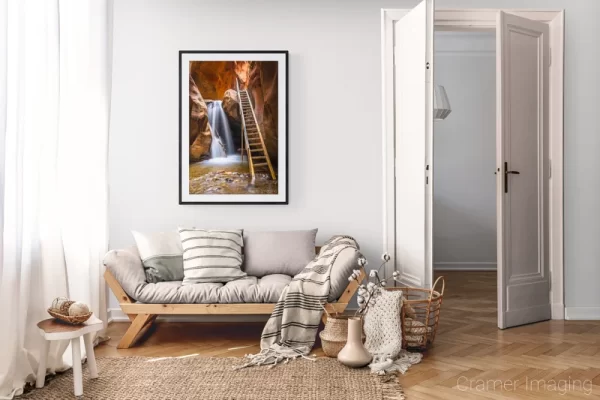 Photograph of Cramer Imaging's landscape photo "Kanarraville Falls" in a cozy neutral-toned living room