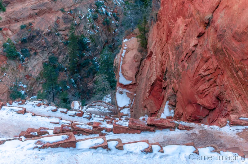 Audrey Cramer Photography's fine art landscape photograph looking down on a snowy Walter's Wiggles in Zion National Park Utah