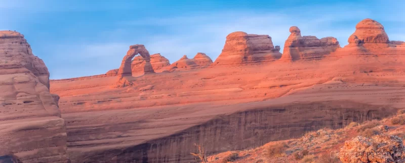 Cramer Imaging's fine art landscape panorama photograph of Delicate Arch at sunset in Arches National Park, Utah