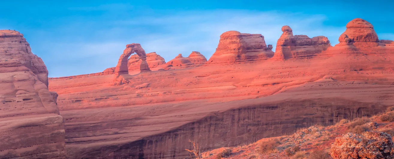 Audrey Cramer Photography's fine art landscape panorama photograph of Delicate Arch at sunset in Arches National Park, Utah