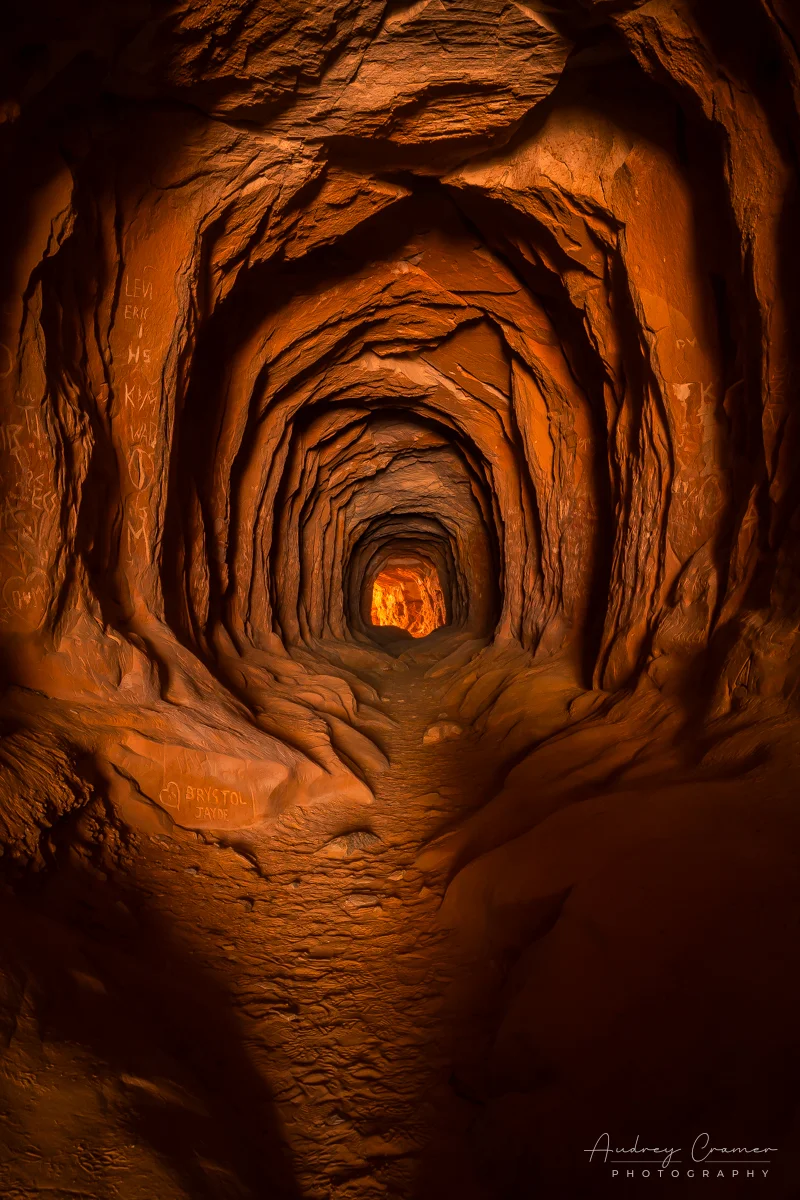 Audrey Cramer Photography's fine art landscape photograph showing light at the end of the "Belly of the Dragon" tunnel near Kanab, Utah