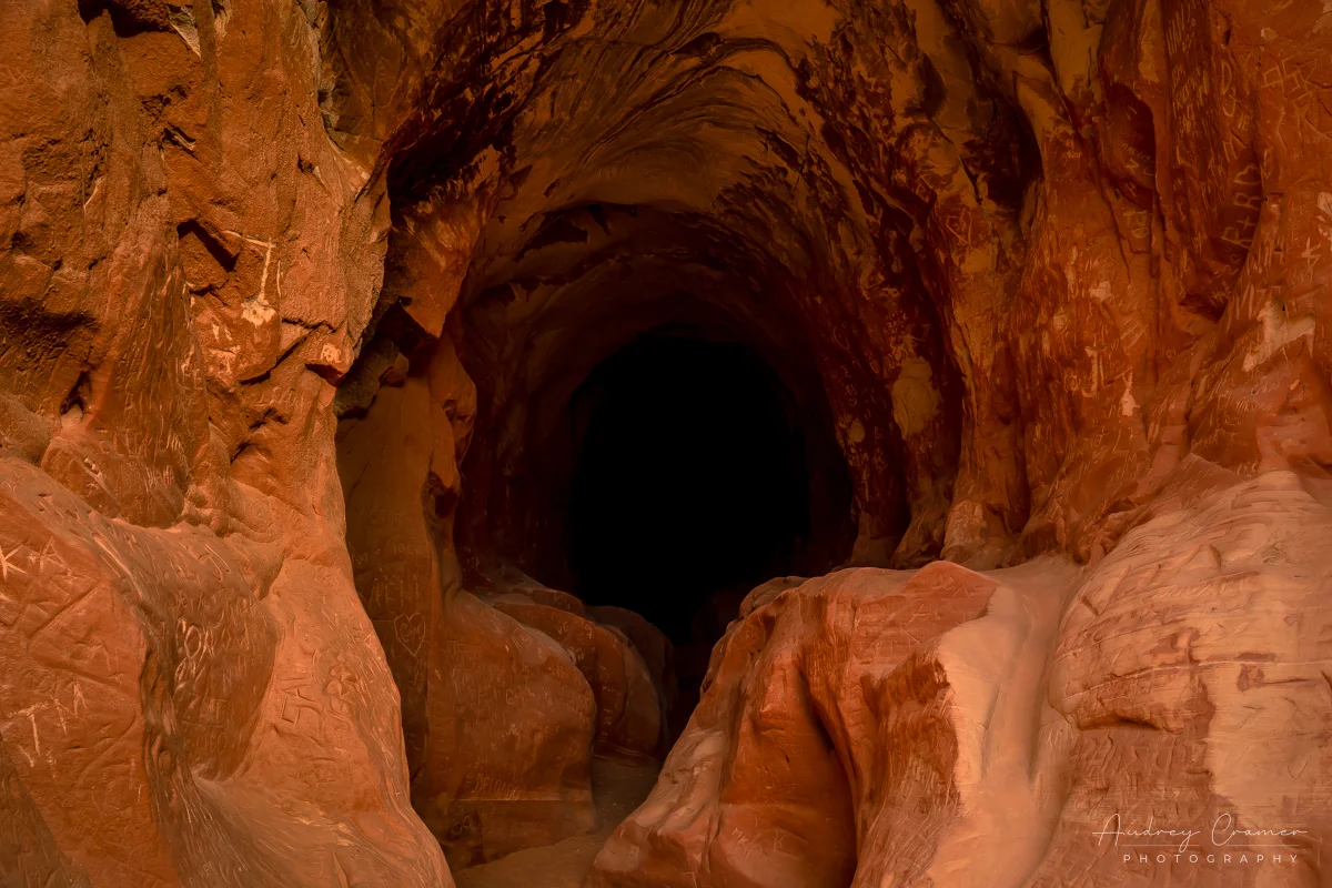 Audrey Cramer Photography's fine art landscape photograph showing the dark tunnel of "Belly of the Dragon" near Kanab, Utah