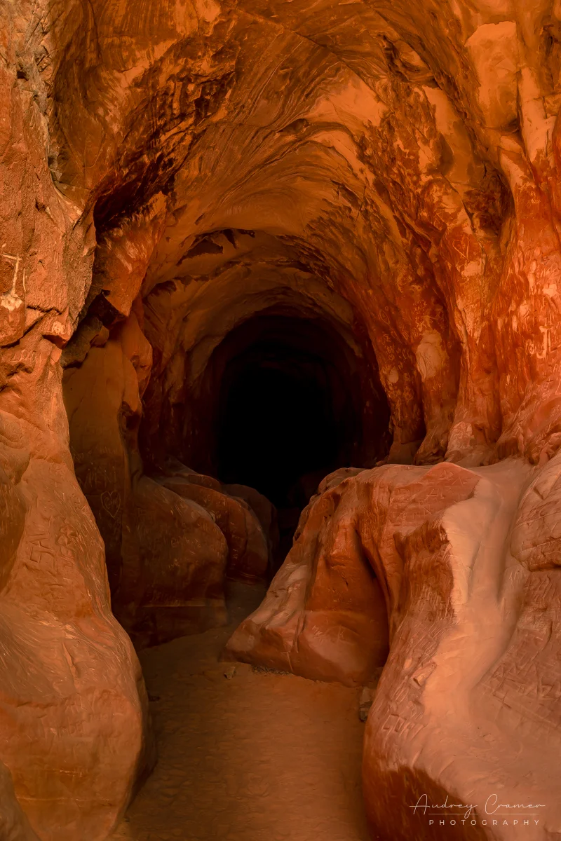 Audrey Cramer Photography's fine art landscape photograph showing the dark tunnel of "Belly of the Dragon" near Kanab, Utah