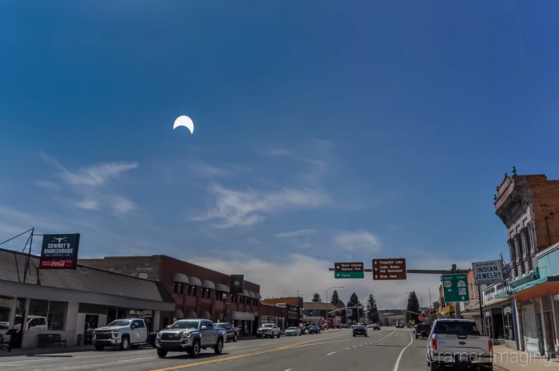 Fine art landscape photograph of the April 8, 2024 total solar eclipse depicted as a partial eclipse over Panguitch, Utah by Cramer Imaging