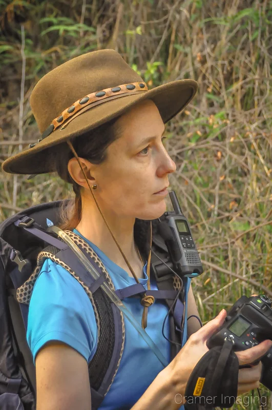 Landscape photographer Audrey Cramer stopping to consider the scene for a photo