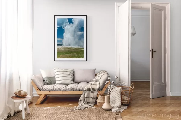 Photograph of Cramer Imaging's landscape photo "Old Faithful with Wildflowers" in a cozy neutral-toned living room