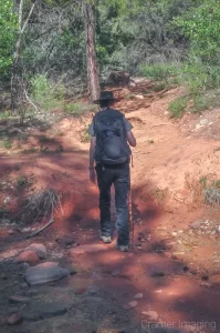 Cramer Imaging's bts photo of landscape photographer Audrey Cramer hiking in Kolob Canyon of Zion National Park Utah