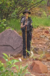 Cramer Imaging's bts photo of landscape photographer Audrey Cramer in a streambed of Kolob Canyon in Zion National Park Utah